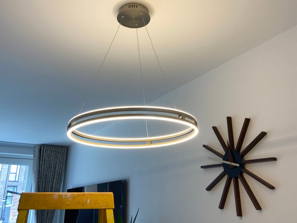 Modern light fixture installation by Edwin's Electrical Services, enhancing the brightness of the space.