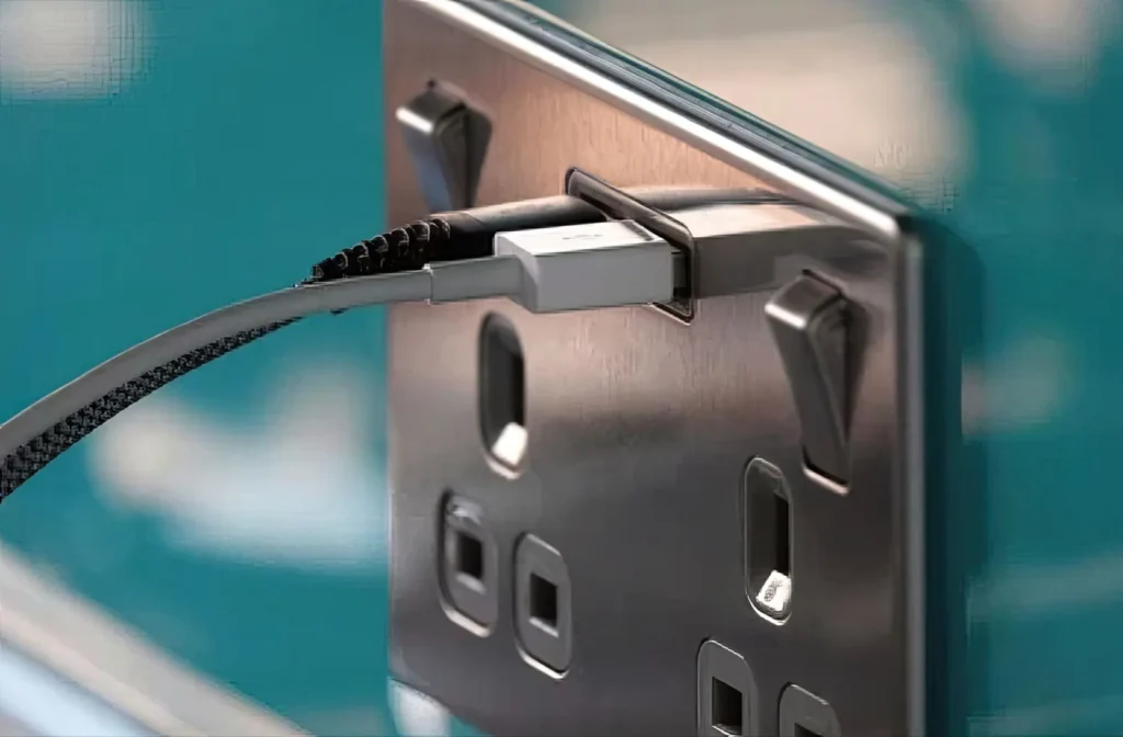 Close-up of a new plug socket installation by Edwin's Electrical Services, showcasing a sleek design and secure connection