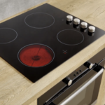 Modern electric hob with a red-hot element, installed and ready for culinary use in a home kitchen.